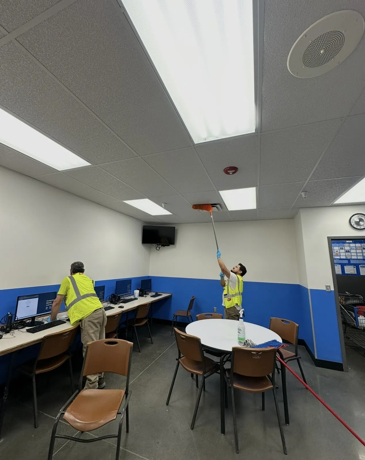 Two J&A crew members cleaning a completed commercial interior